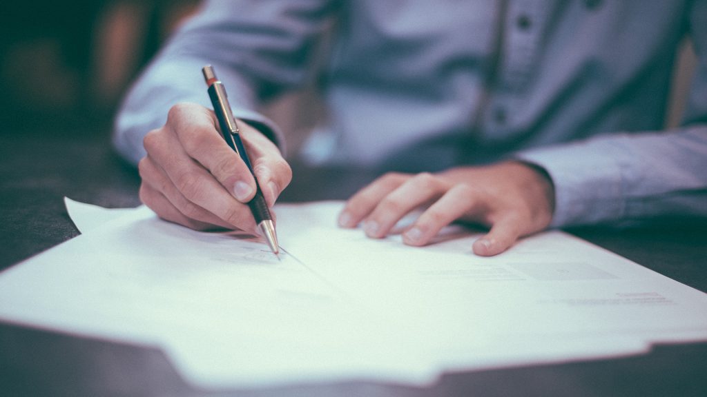 Man writing on paper