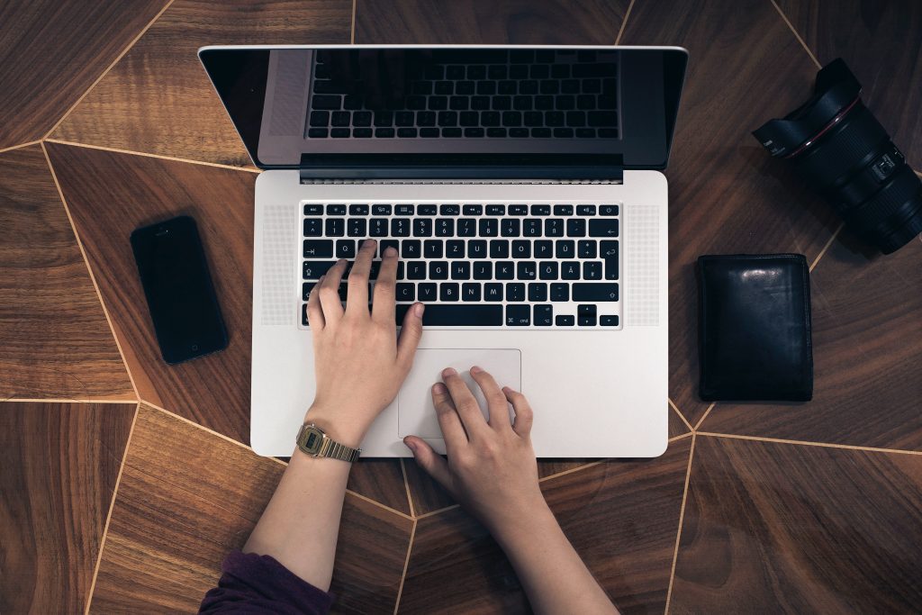 Man writing on the laptop