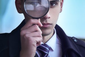 A man holding a magnifying glass