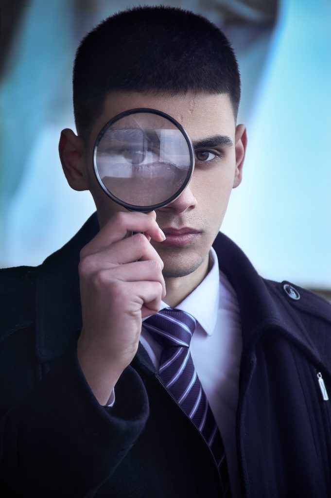 A man holding a magnifying glass