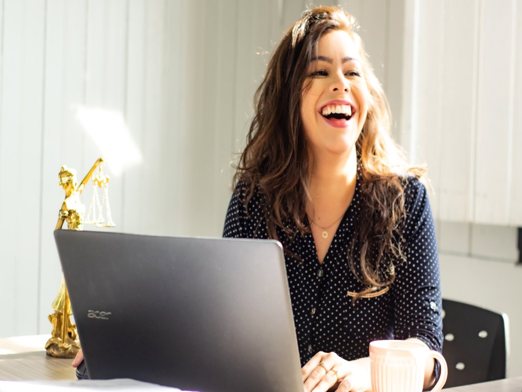 Smiling girl with laptop