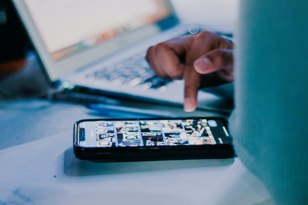 Man with laptop and mobile