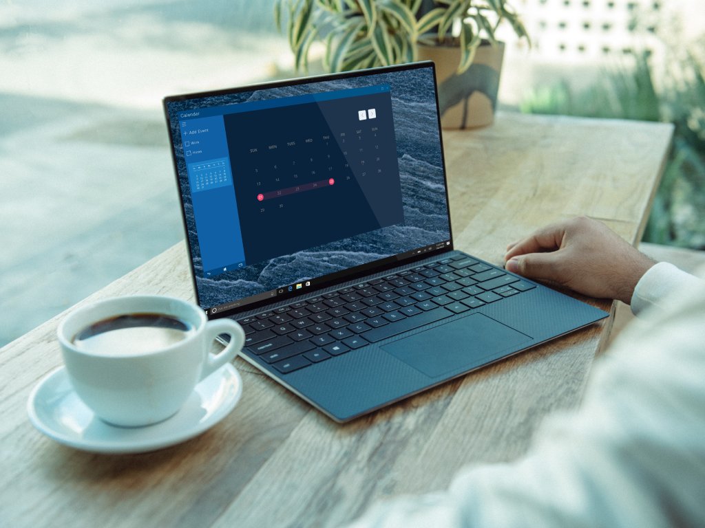 Man with a laptop and a coffee