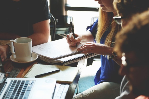 Woman with a notebook and teamwork